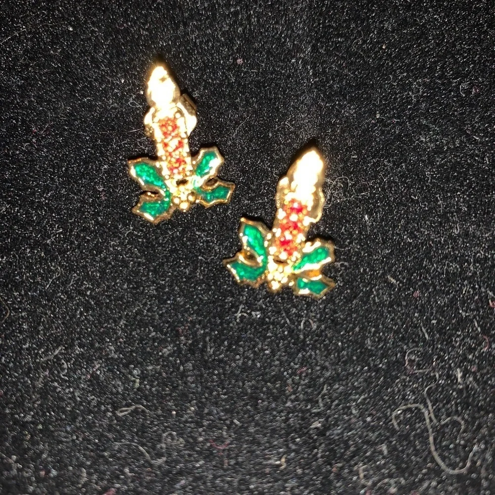 A set of Candles burning in a bed of ivy earrings
